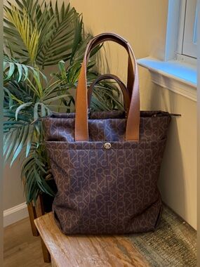 NWOT Calvin Klein Large Tote Bag in Signature Brown.  Fits a laptop.